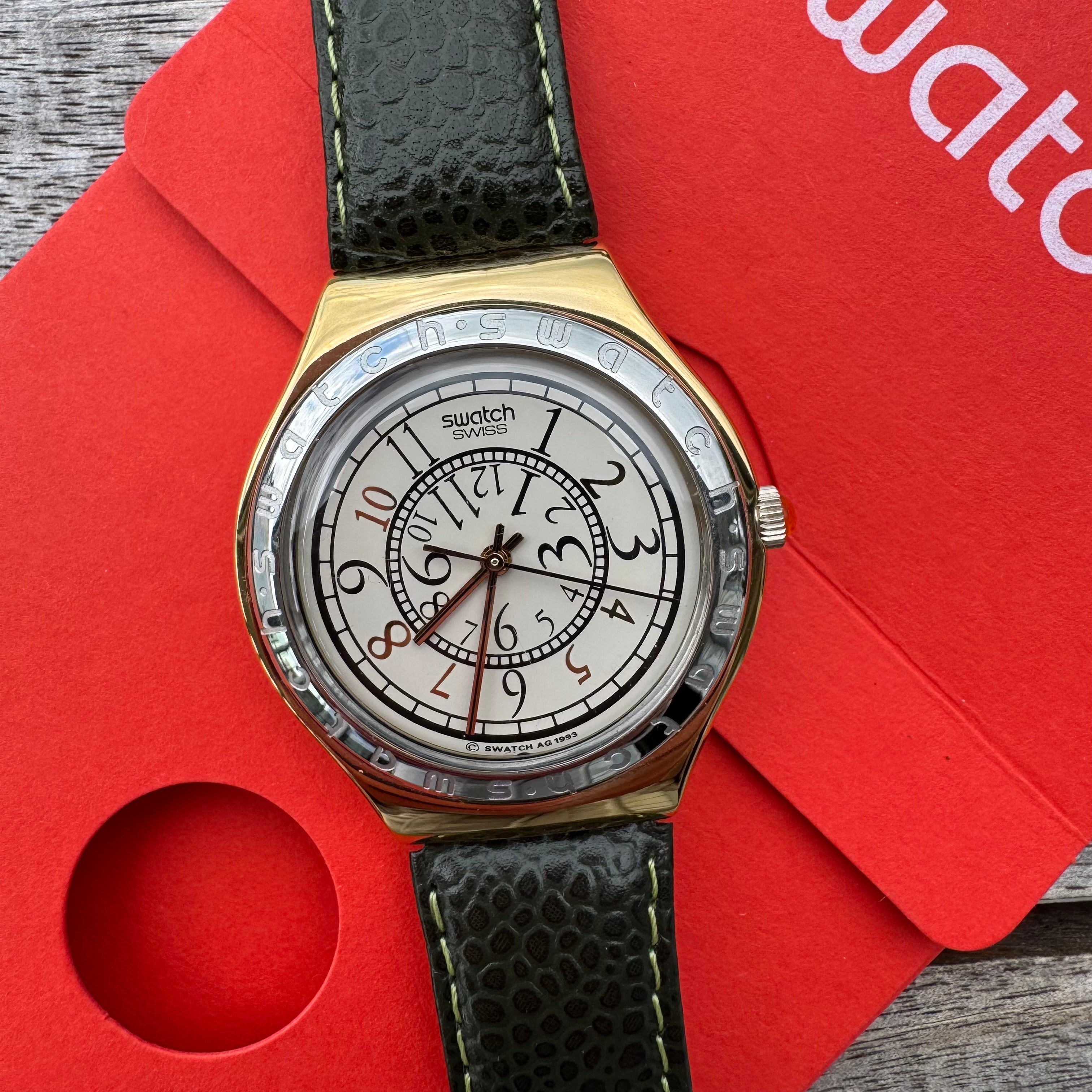 Swatch Irony Big RENVERSE YGG100, elegant vintage stainless steel